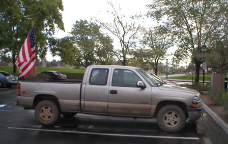 27 February 2003 - My Silverado, with it's FLAG, parked in front of the Calence Building