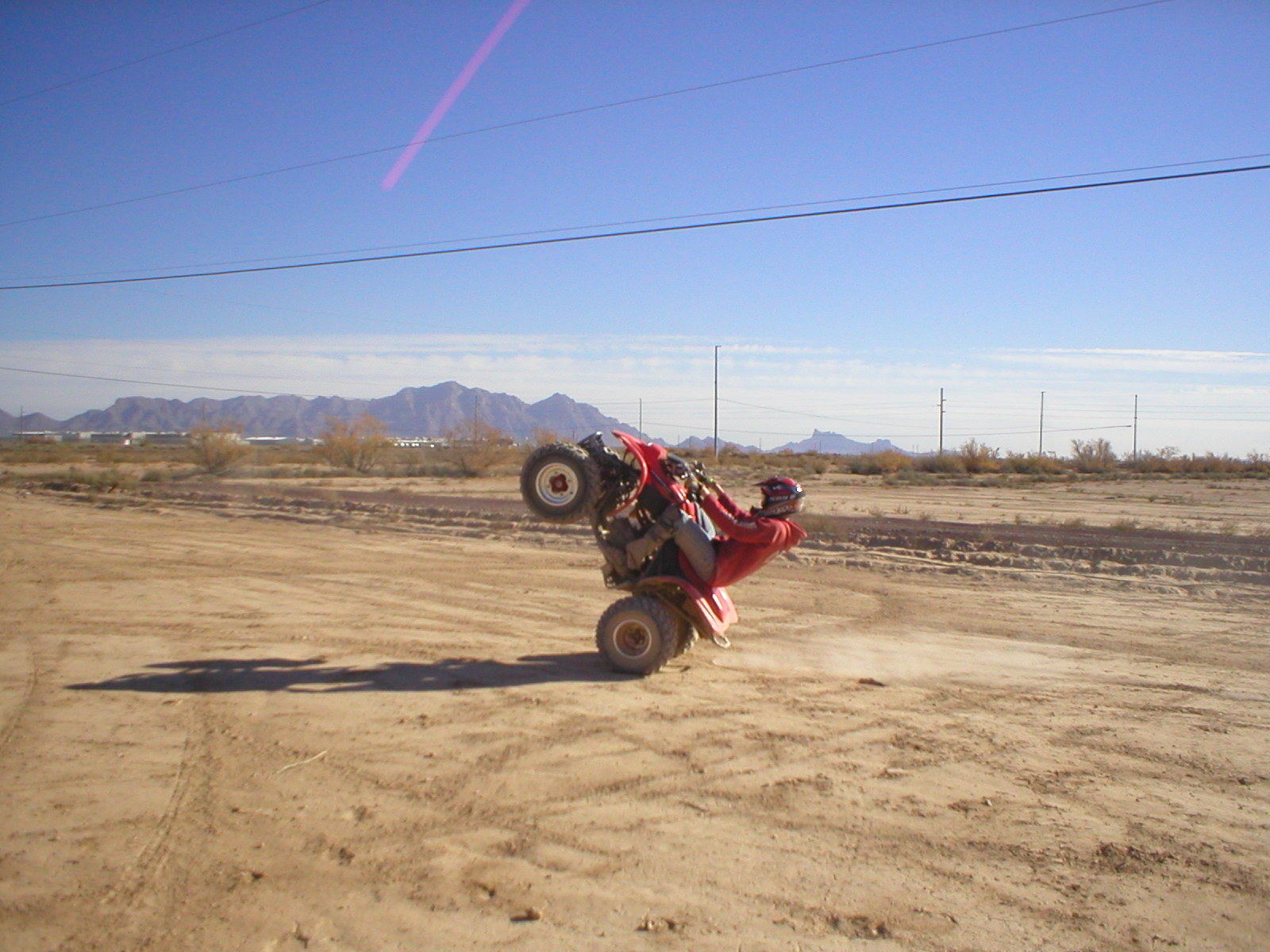 23 December 2004 - Jared can ride the quad on two wheels!!
